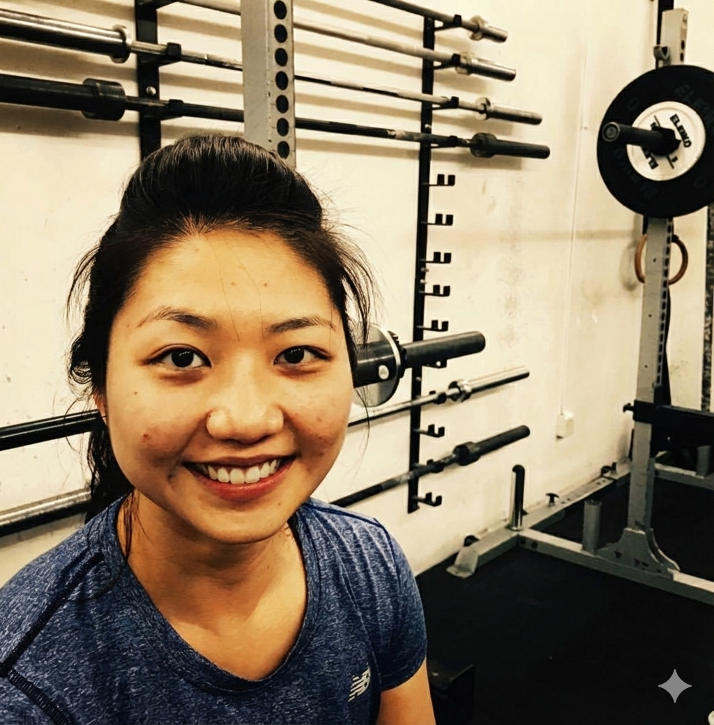 Woman smiling during her workout, showcasing that strength training can be enjoyable and sustainable for long-term health.
