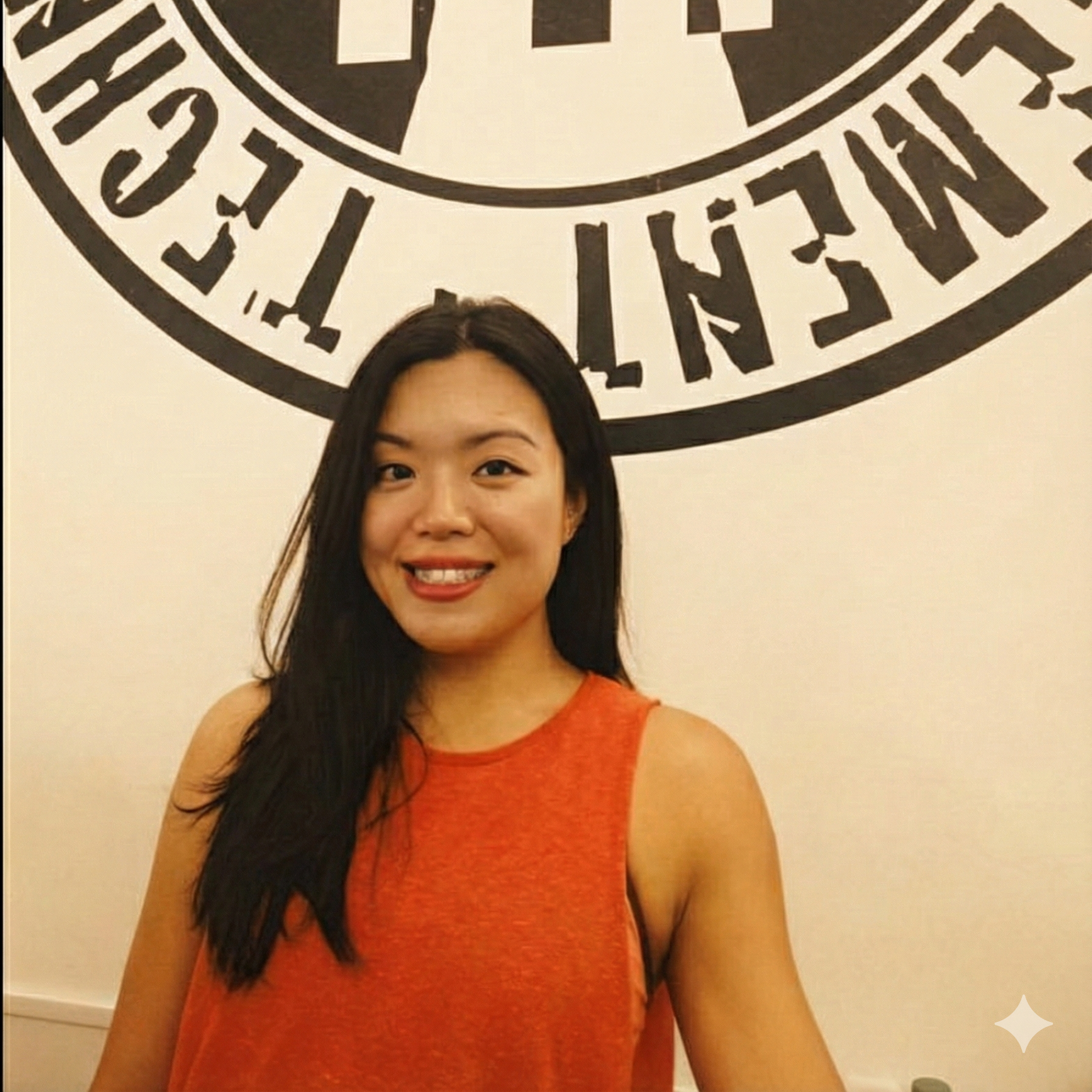 A happy female client feeling comfortable and confident during a personal training session at The PIT, a non-intimidating private Personal Training gym.