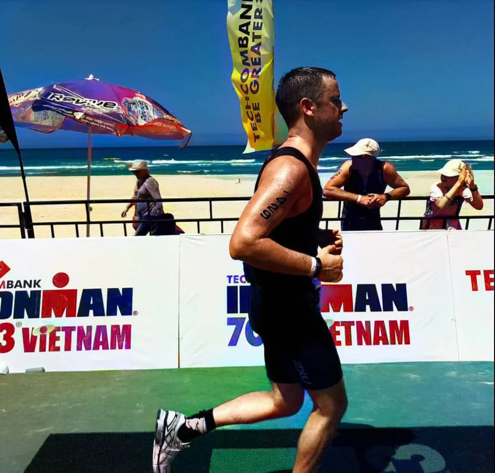 Ross completing an Ironman event after recovering from spinal surgery