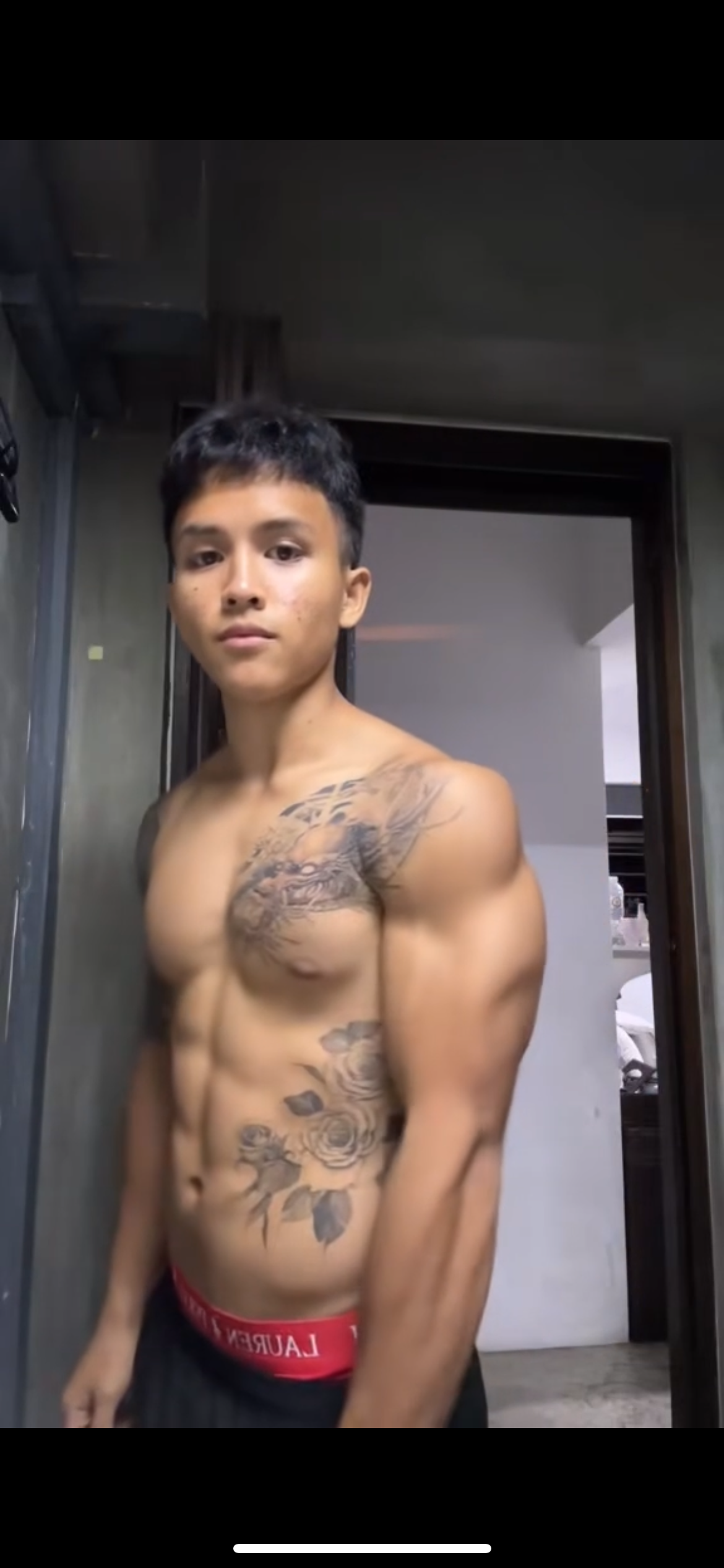 Trainer Miles Showcasing His Physique