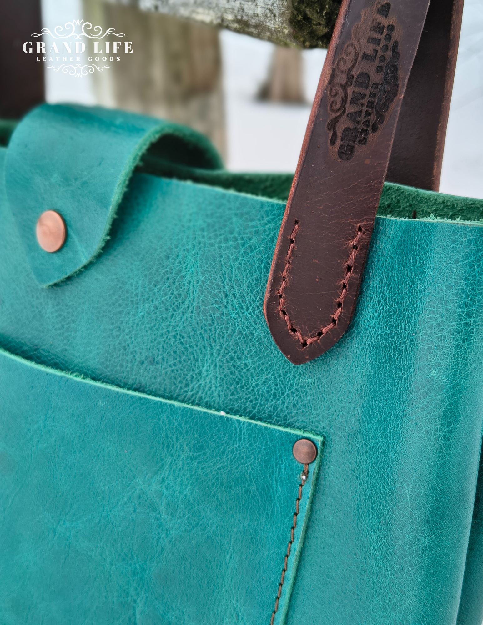 handcrafted leather purse with flap closure top detail.png