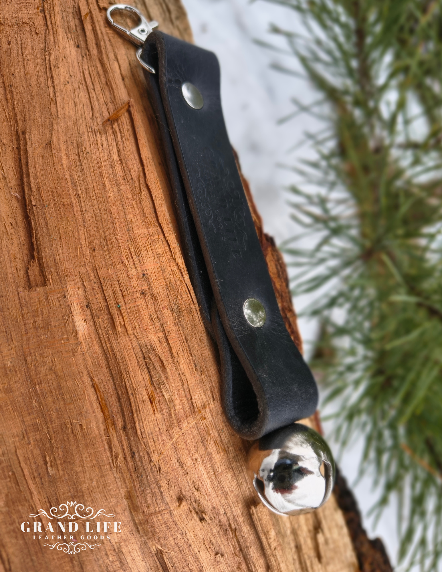handcrafted leather sleigh bell keychain - hiker bell silver on black strap2.png