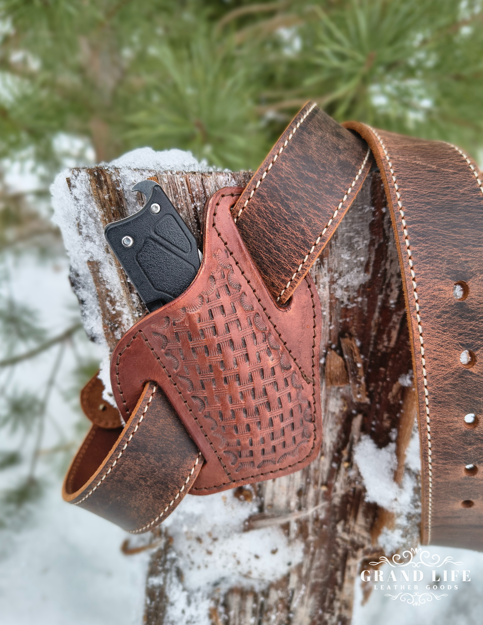 handcrafted leather knife case on belt.png