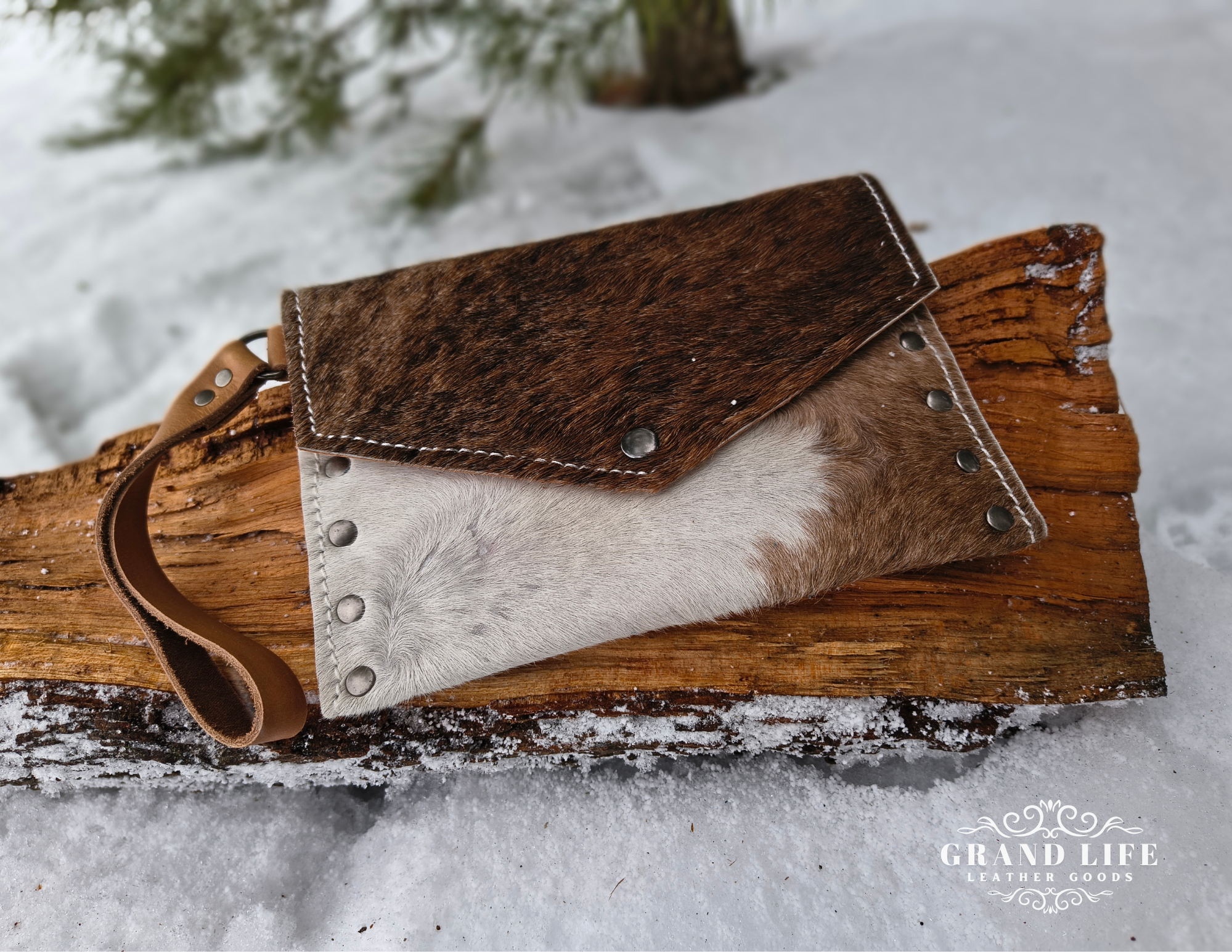 handcrafted leather cowhide clutch.png