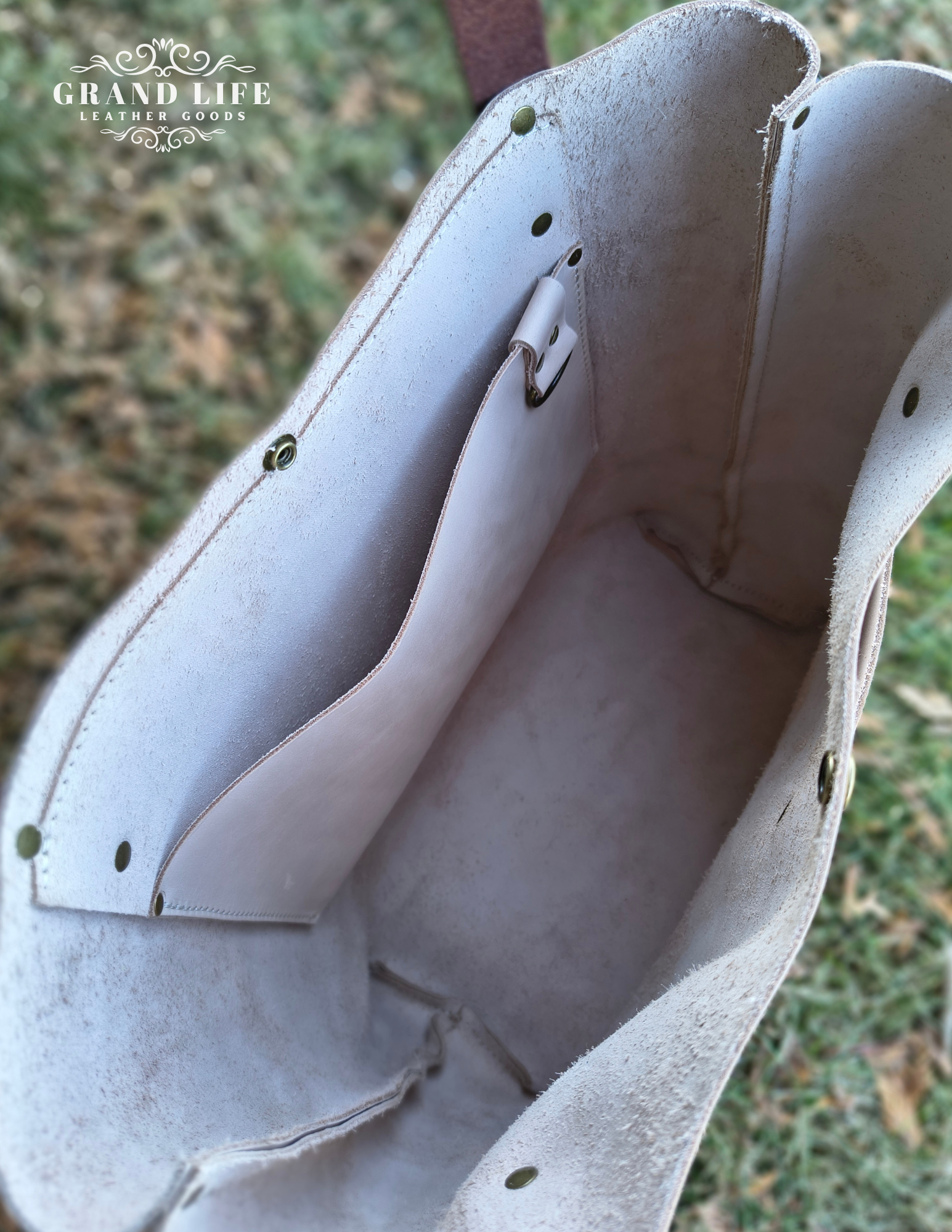 handcrafted leather carry all tote bag with snap top interior.png