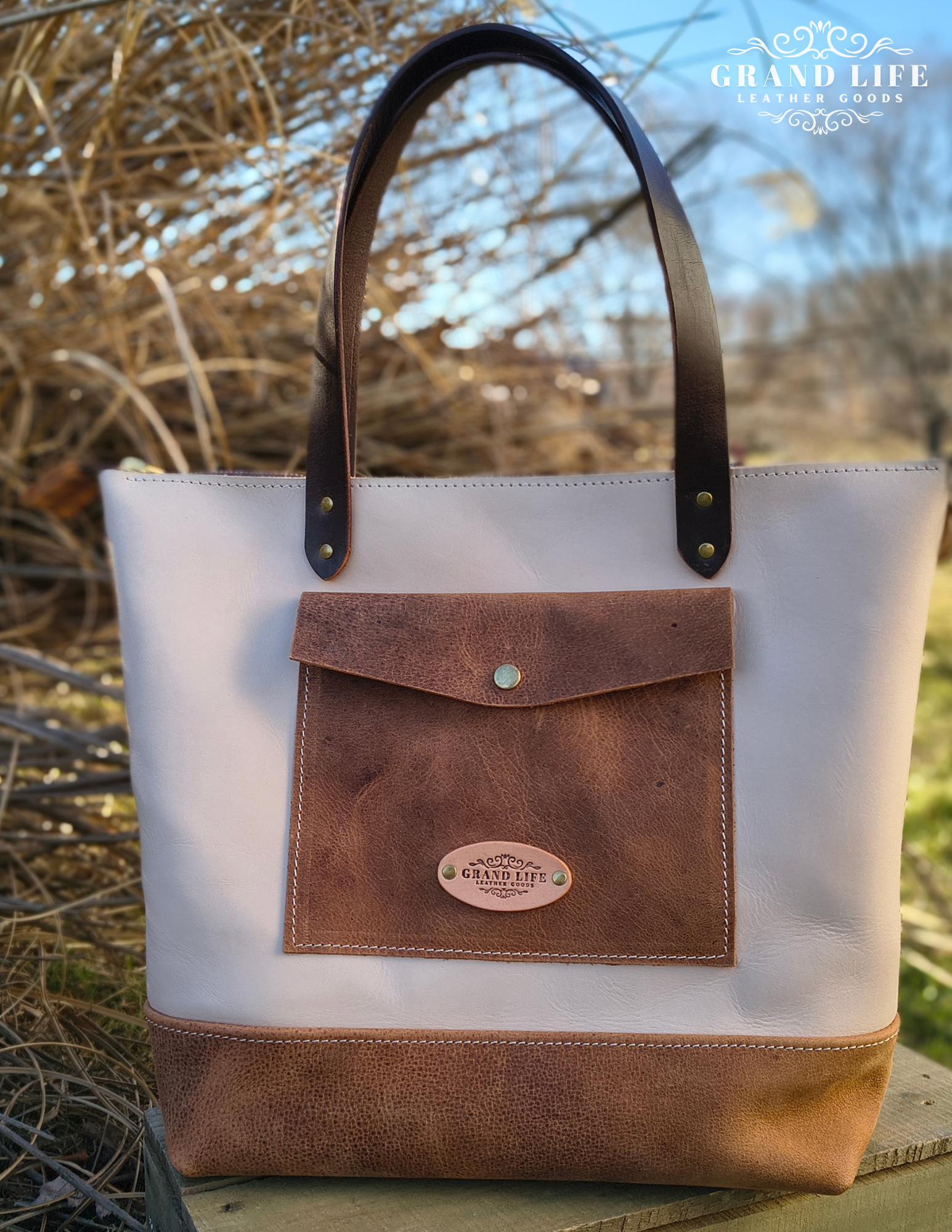 handcrafted two tone leather tote bag snap flap front pocket.png