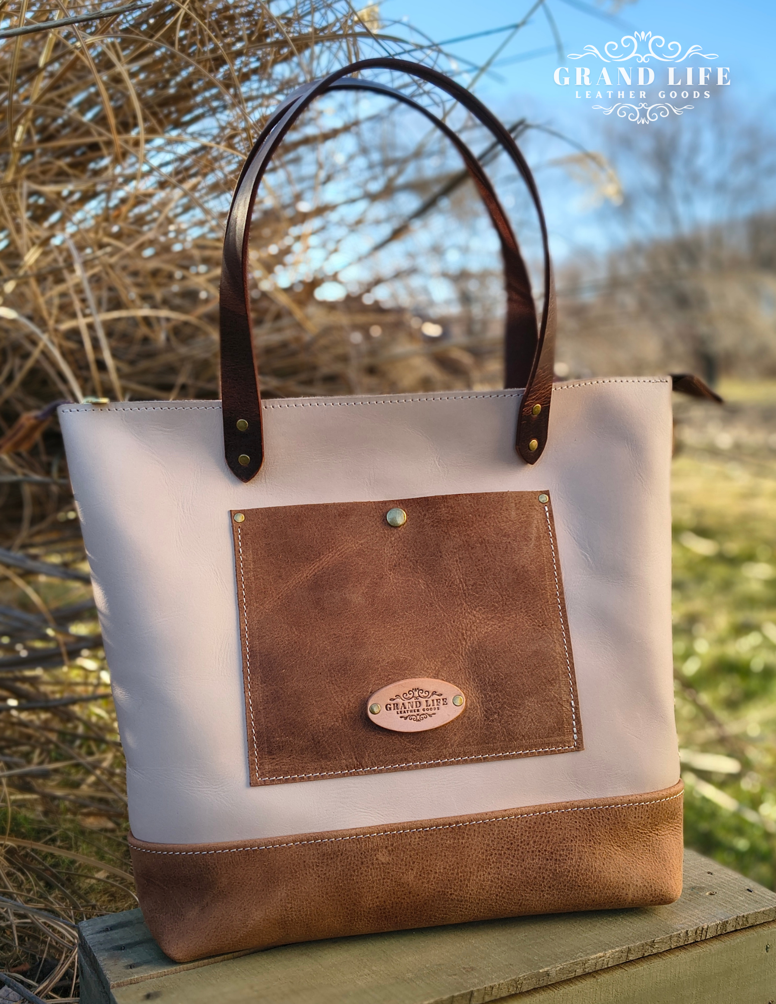 handcrafted two tone leather tote bag snap front pocket.png