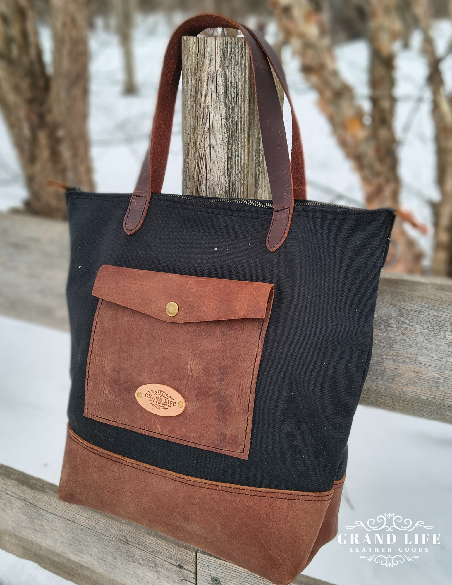 black canvas leather tote bag.png