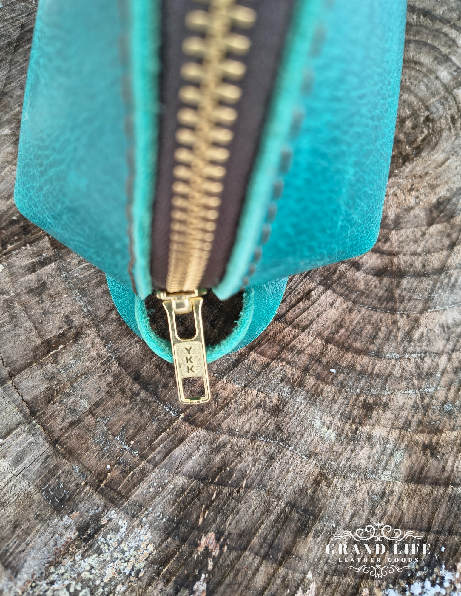 leather crescent pouch personal care travel bag teal detail.png