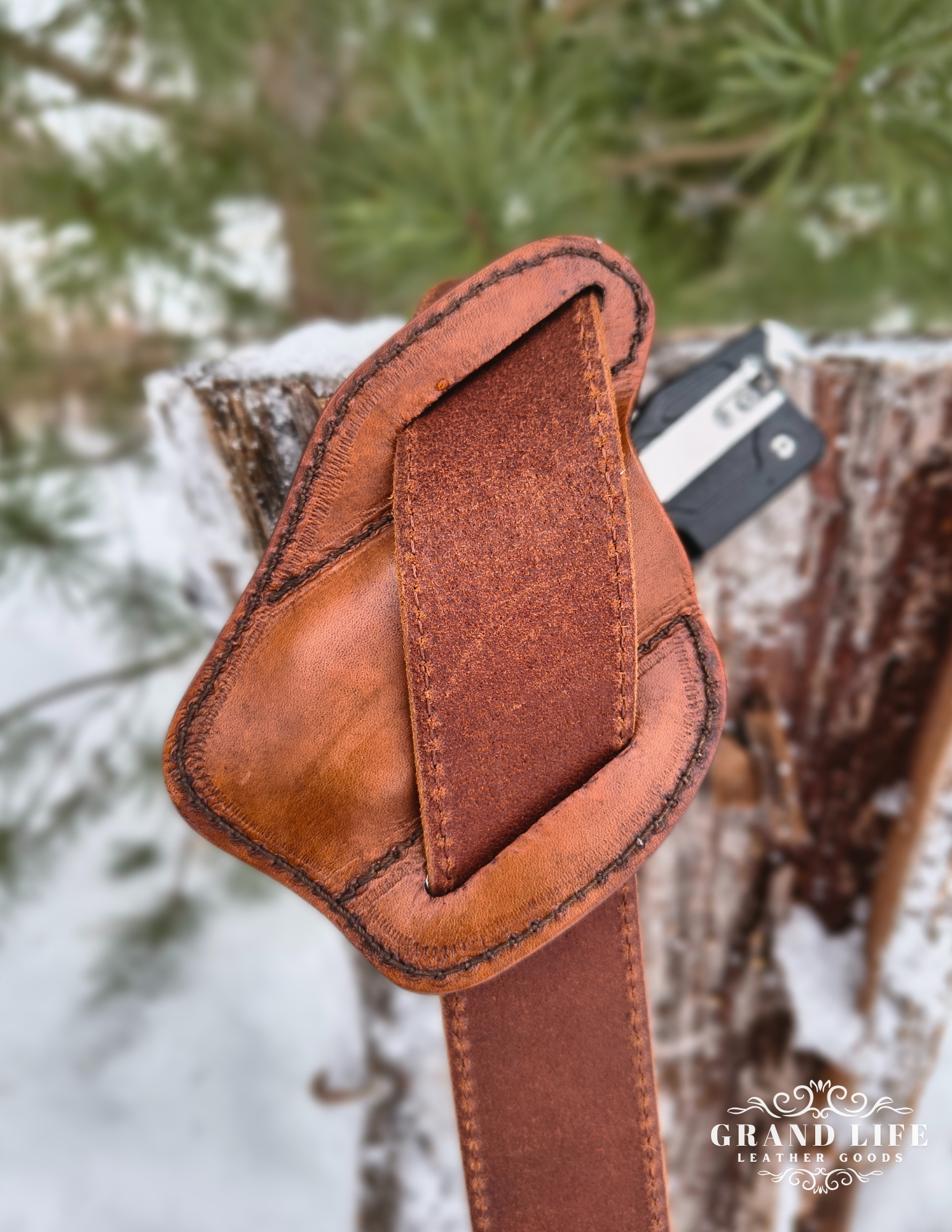 handcrafted leather knife case on belt back.png