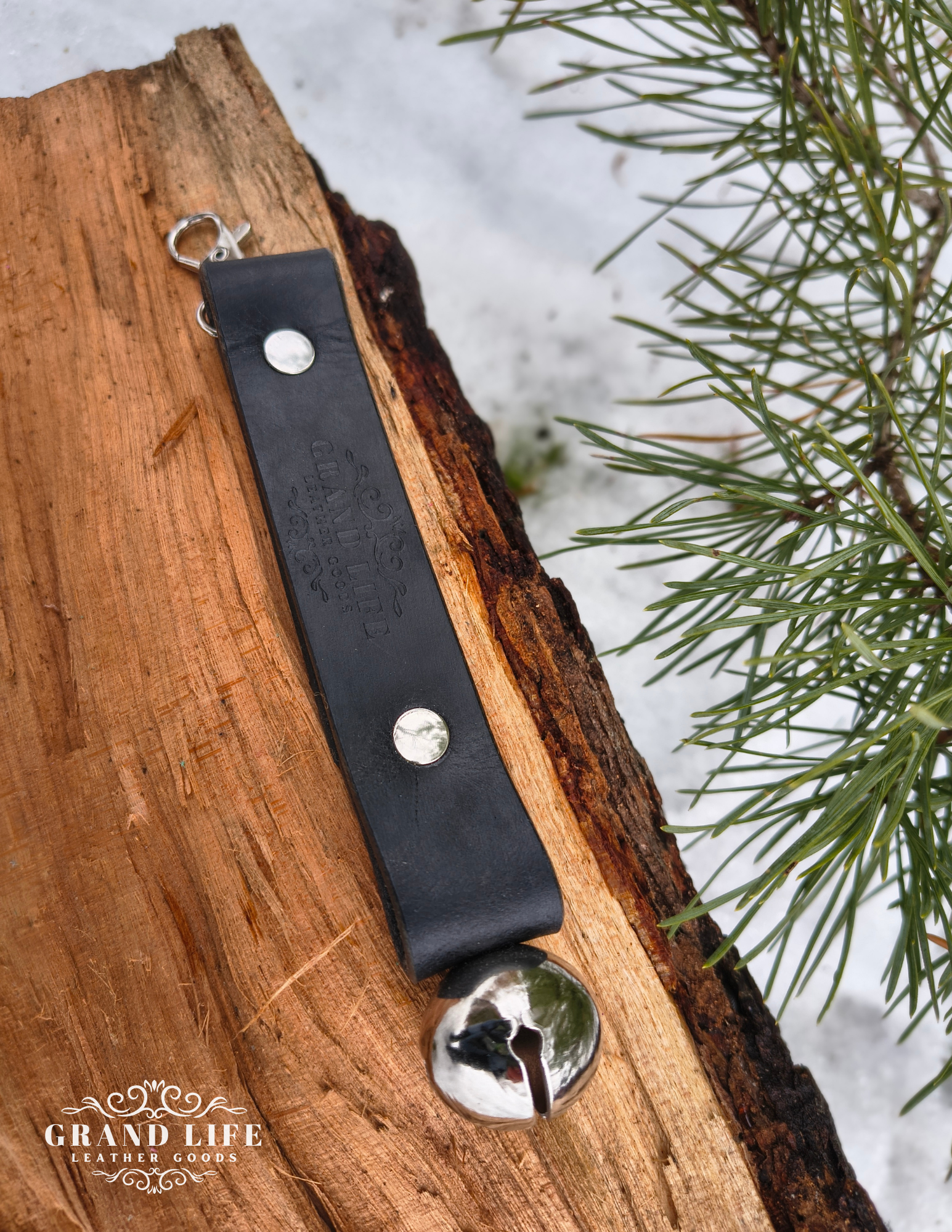 handcrafted leather sleigh bell keychain - hiker bell silver on black strap.png