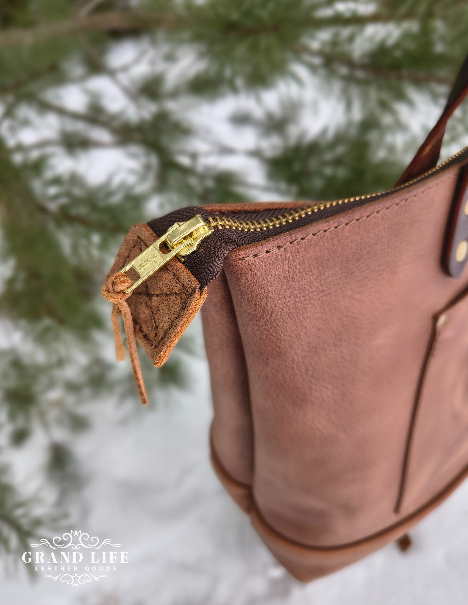 handcrafted leather tote bag with zipper top closure zip detail.png