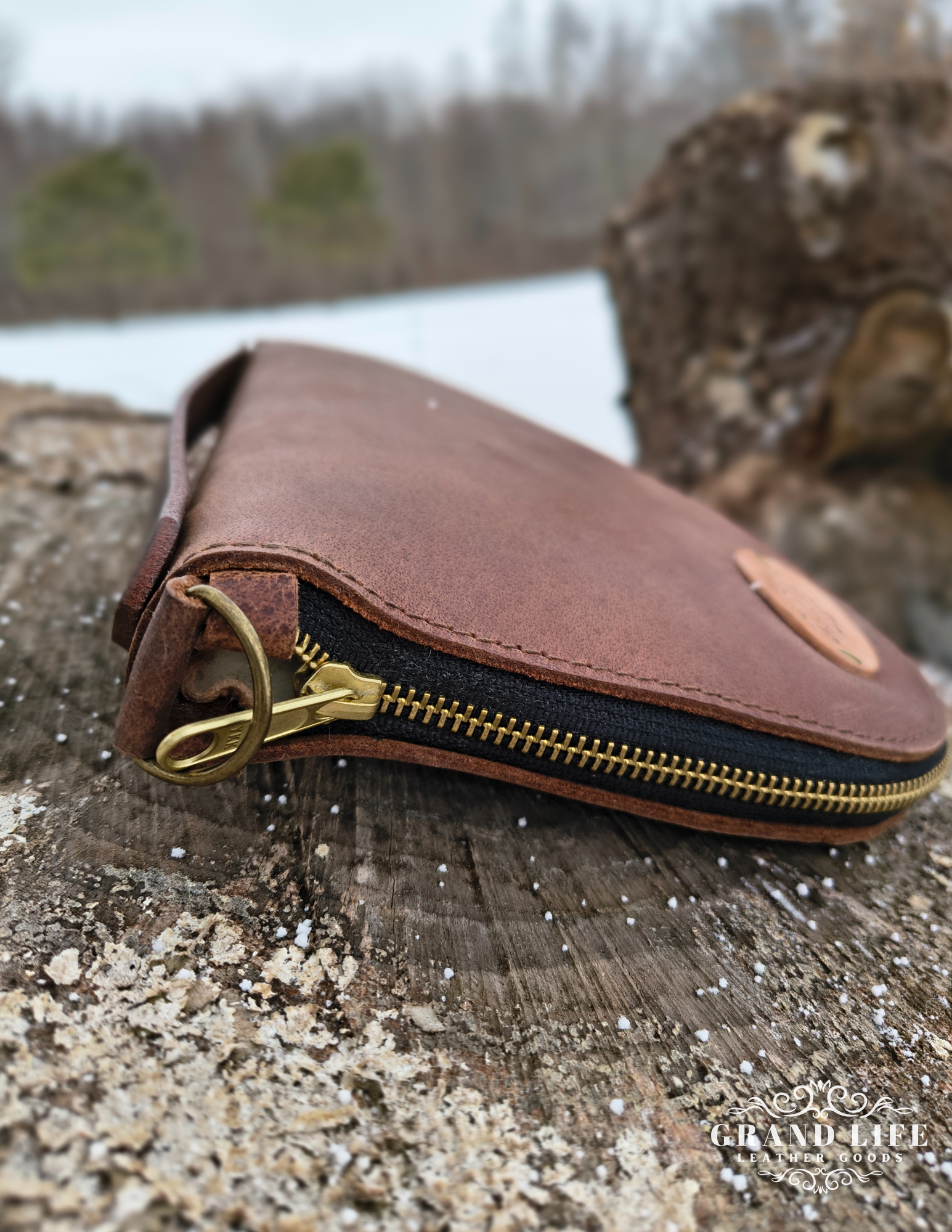 leather pistol case with wool lining lockable zipper.png