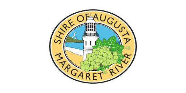 Seal of the Shire of Augusta, Margaret River featuring a lighthouse, water, and a bunch of green grapes.