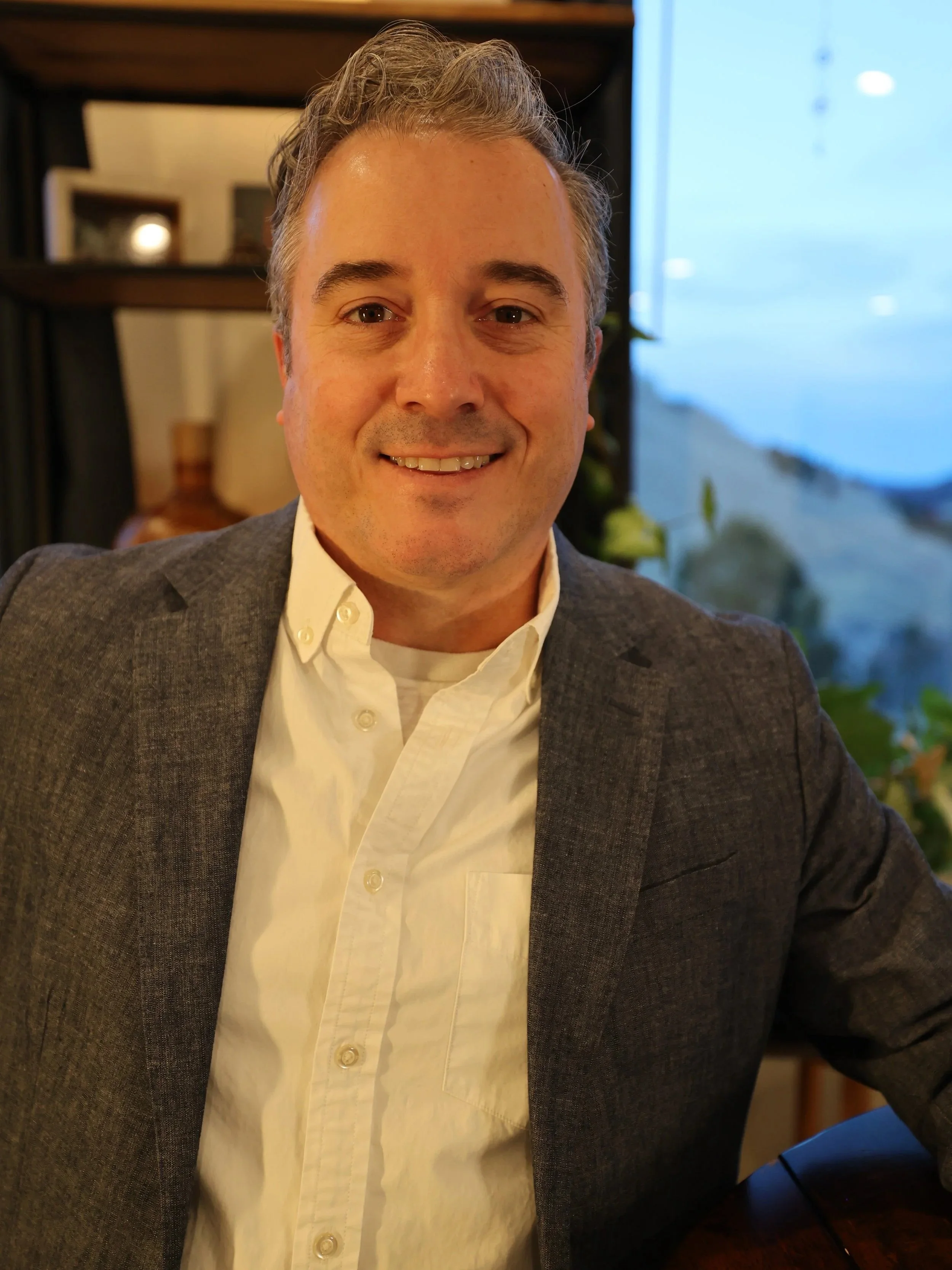 Portrait of Daniel Cameron, consultant and creator, smiling in a casual professional setting