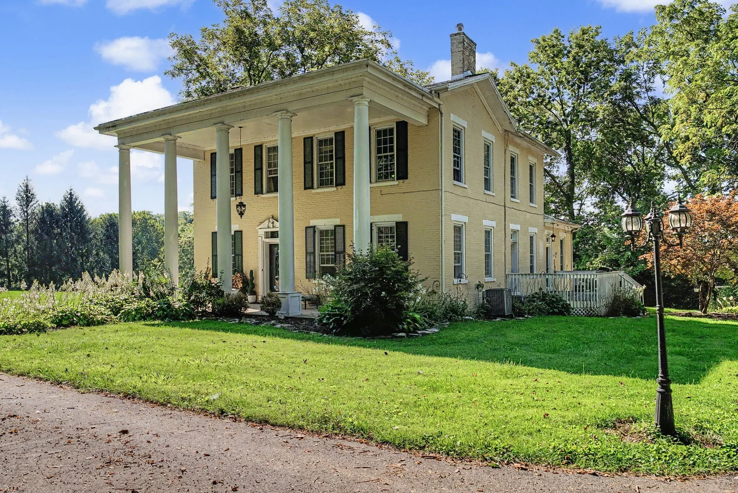 Columned front exterior of 567 Shepherd Rd, Xenia, OH on its 2.633 acre lot