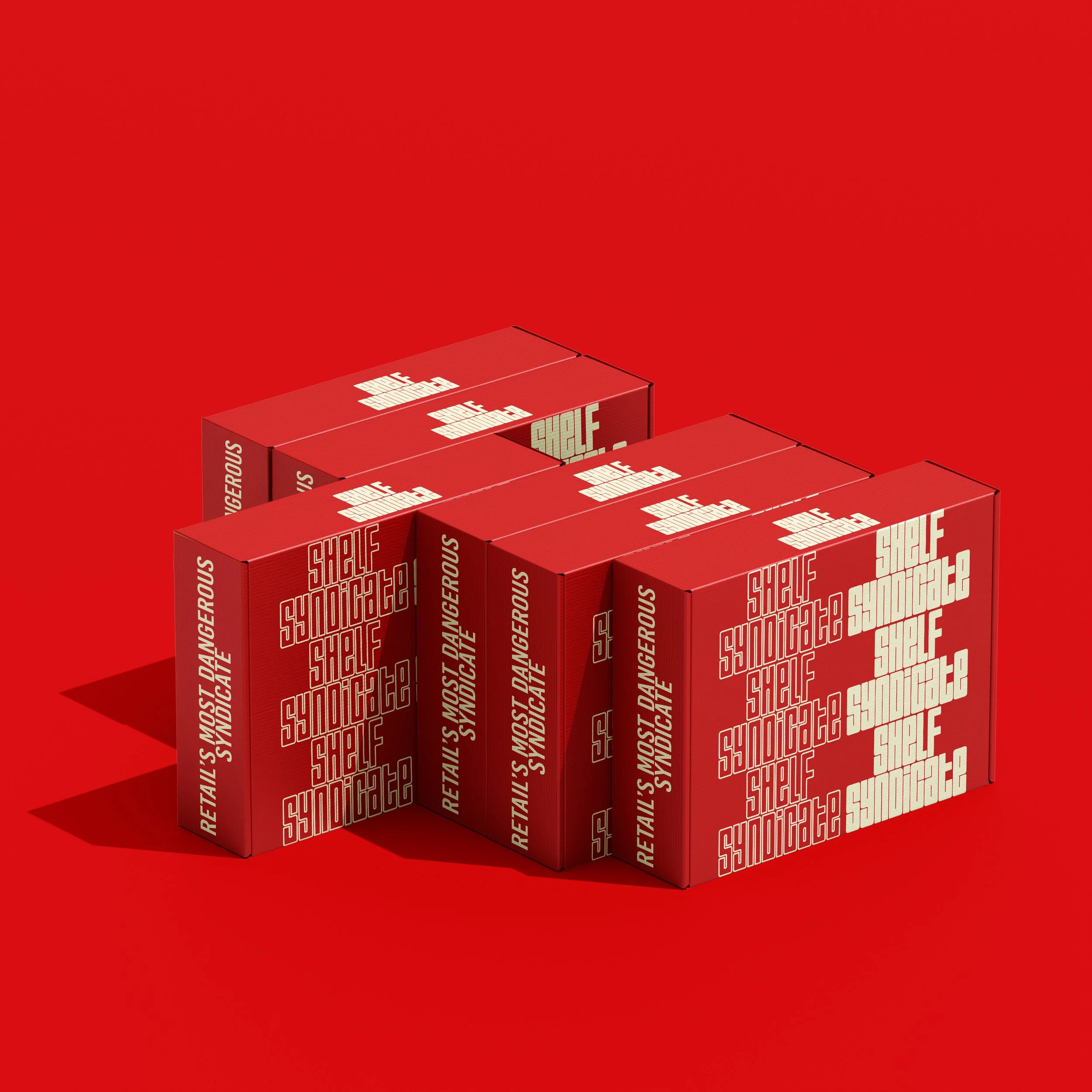A collection of red boxes with white text, arranged to spell out words on their sides, on a red background. The words include 'SHELF', 'SYNDICATE!', and 'RETAIL'S MOST DANGEROUS'.
