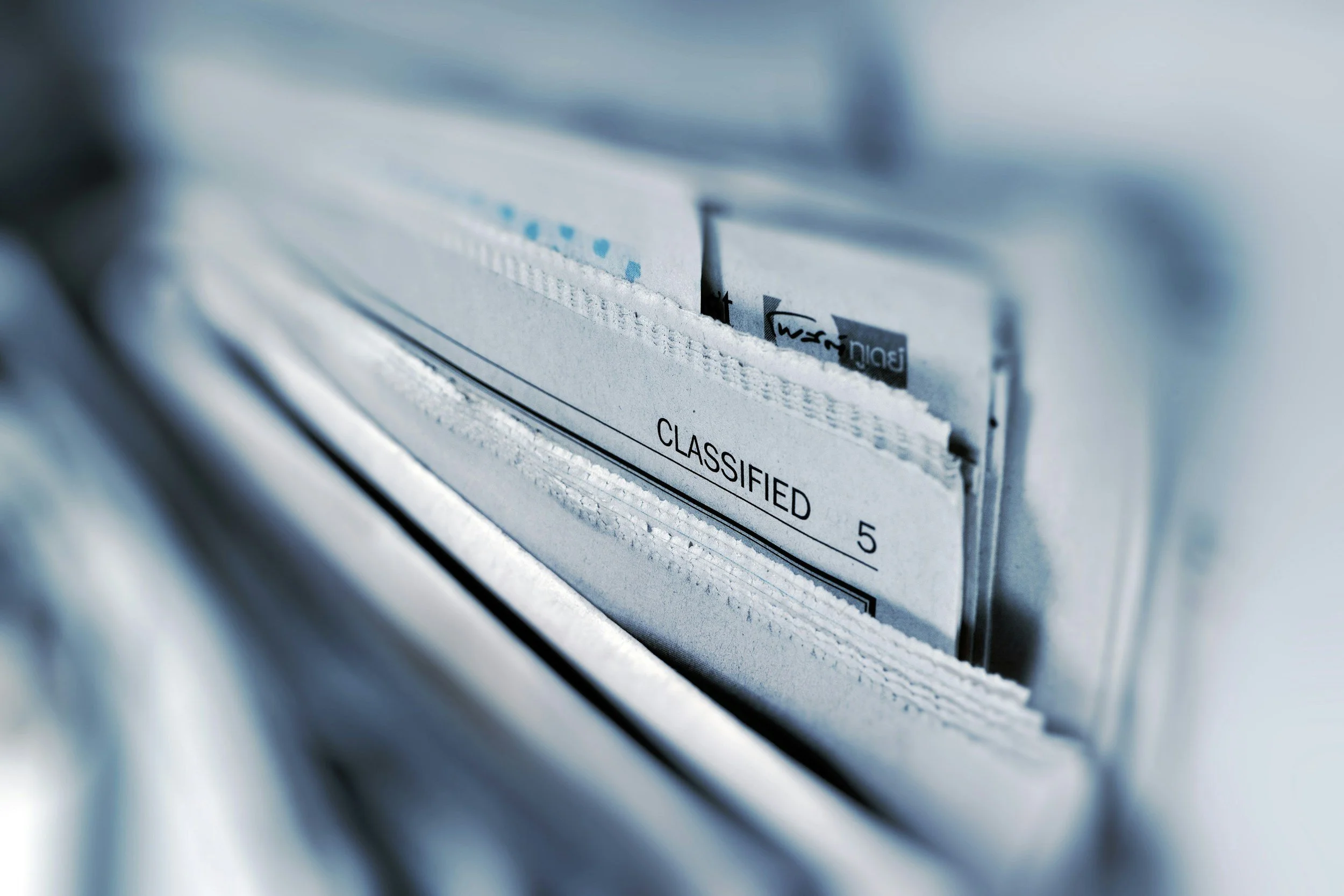 File folders organized in a filing system, representing centralized information and resources.