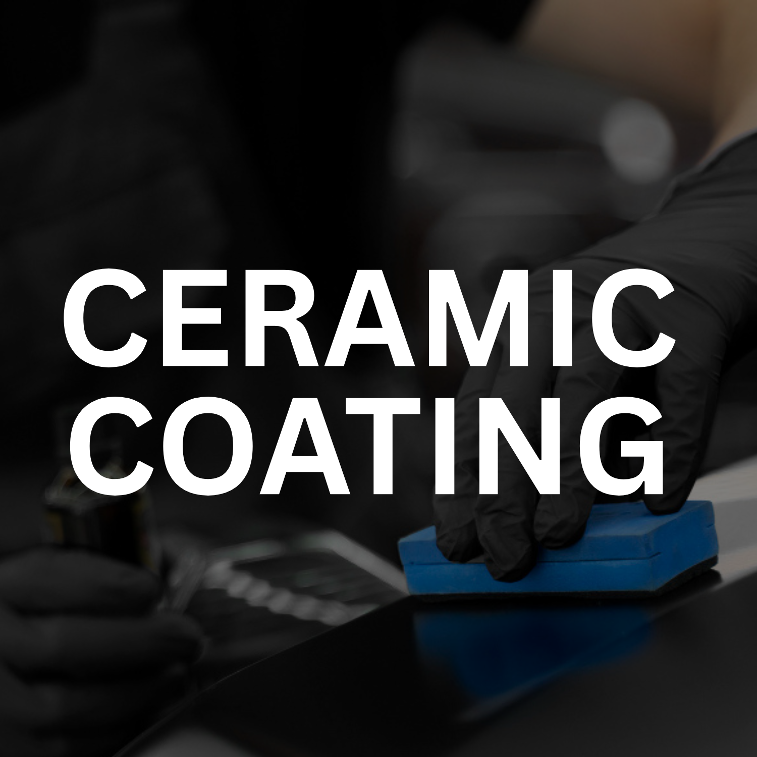 A person wearing black gloves applying ceramic coating to a car surface using a blue sponge.