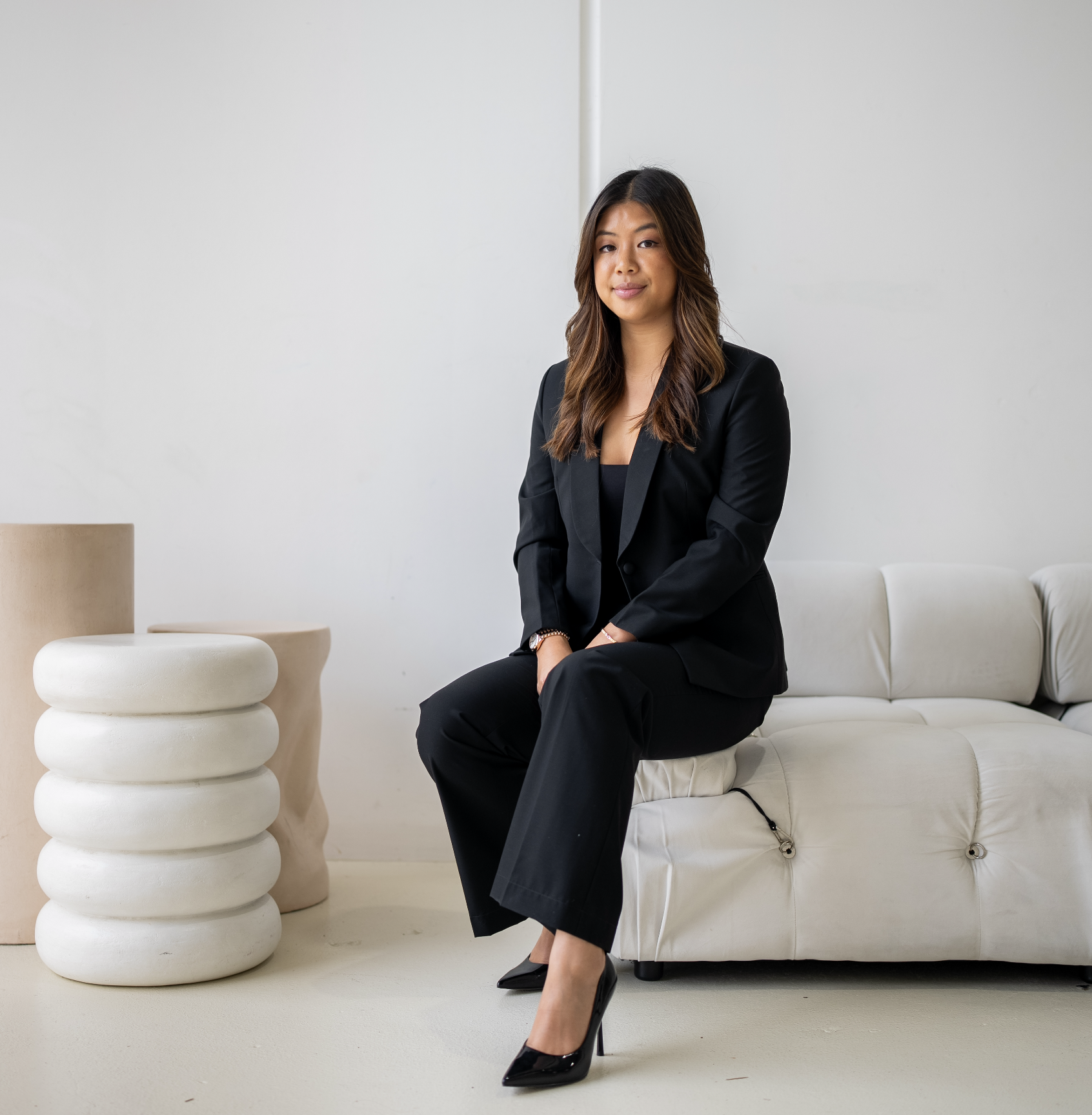 Serena, founder of Naviyo, sitting in a minimalist studio, discussing how to navigate the property market without the noise."