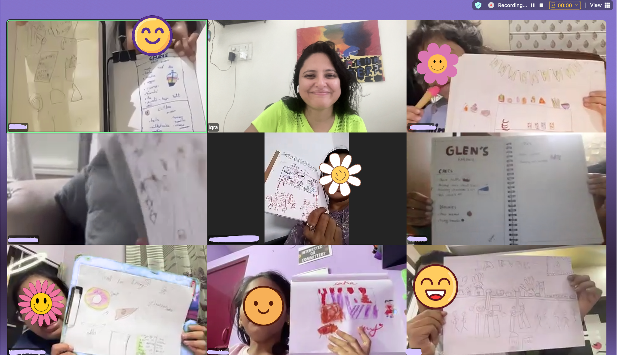 Screenshot of a virtual meeting with children and an adult woman, with children showcasing their drawings, and the woman smiling at the center of the screen.