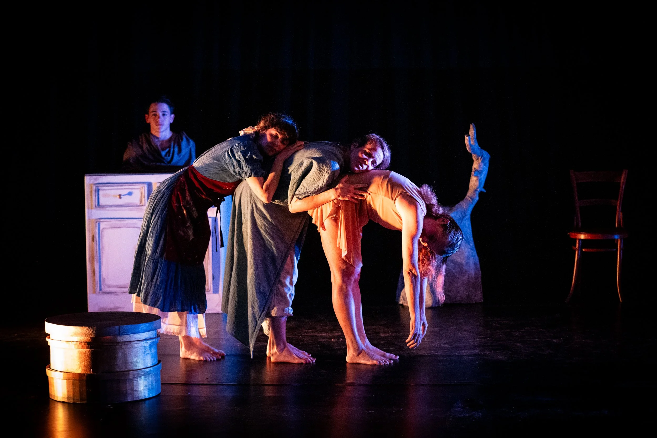 Four performers moving together on stage during Perth French Theatre’s production of Je suis Camille.