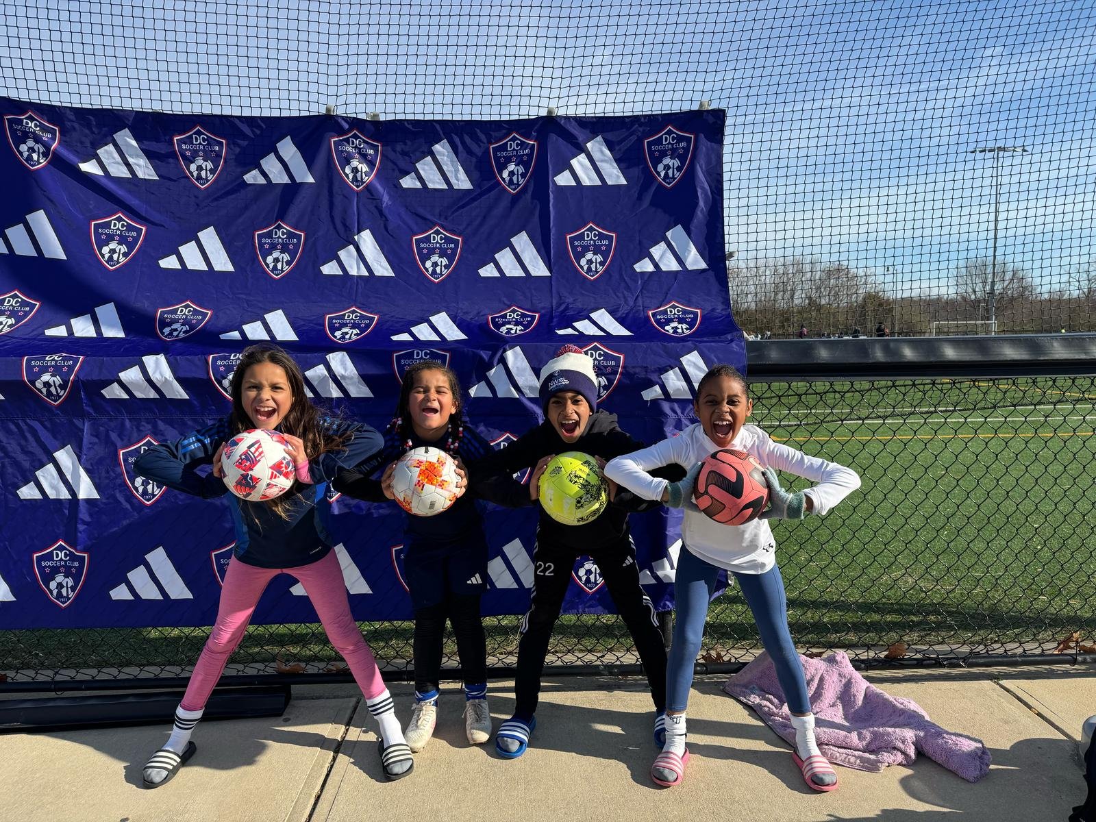 U10 soccer players holding soccer balls_soccer performance training