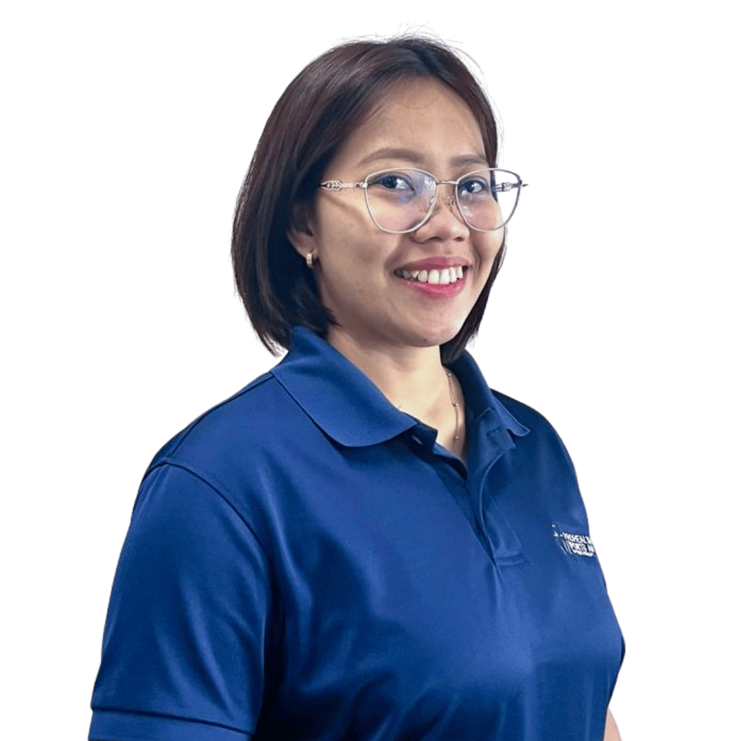 A woman with short brown hair, glasses, and a blue polo shirt smiling.