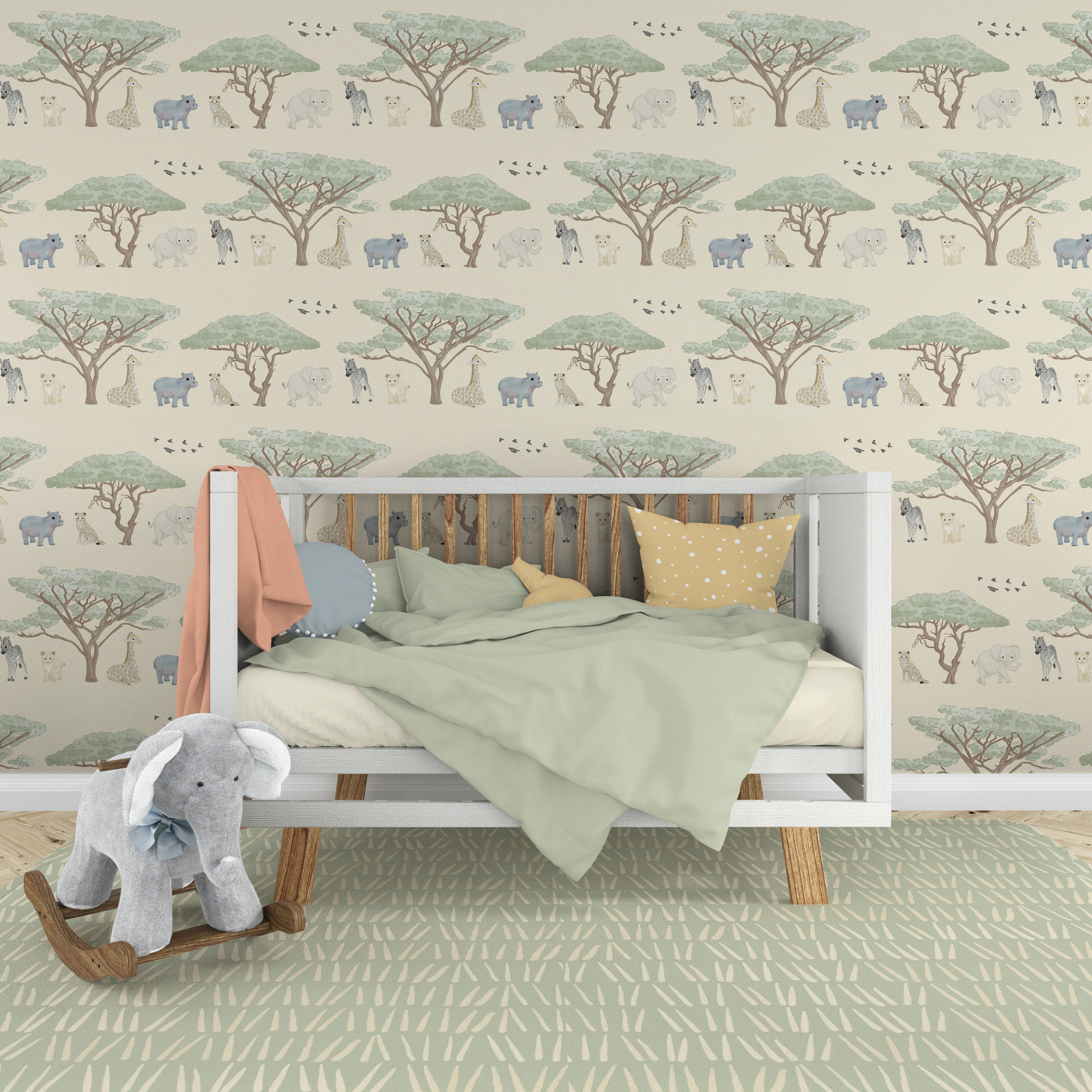 A children's bedroom with a white bed frame, pastel green bedding, and decorative pillows, against a wallpaper with a safari pattern of trees and animals, and a plush elephant rocker.
