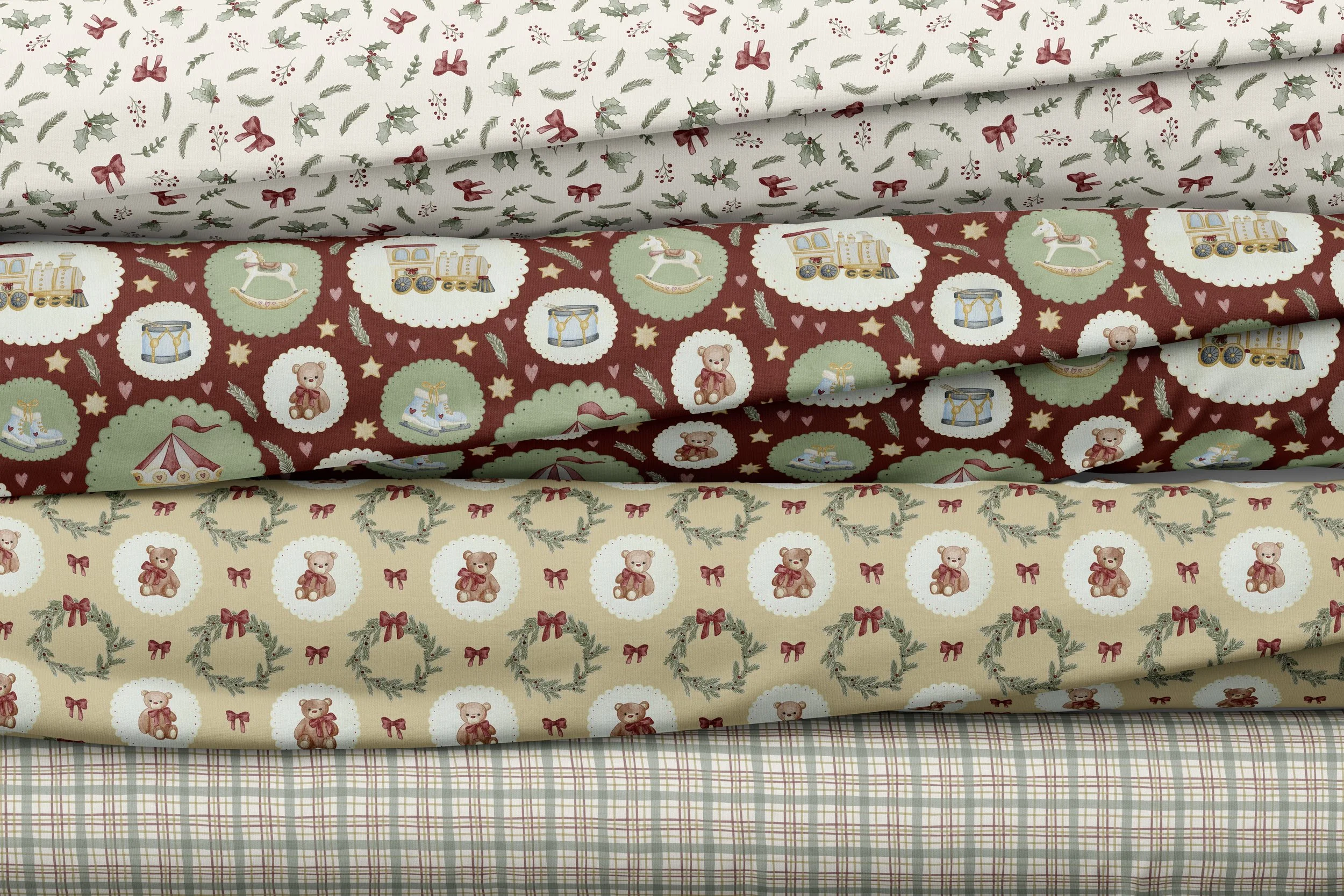 Four rolls of Christmas-themed fabric with various holiday patterns, including holly leaves and berries, teddy bears with bows, Christmas wreaths, and plaid designs.