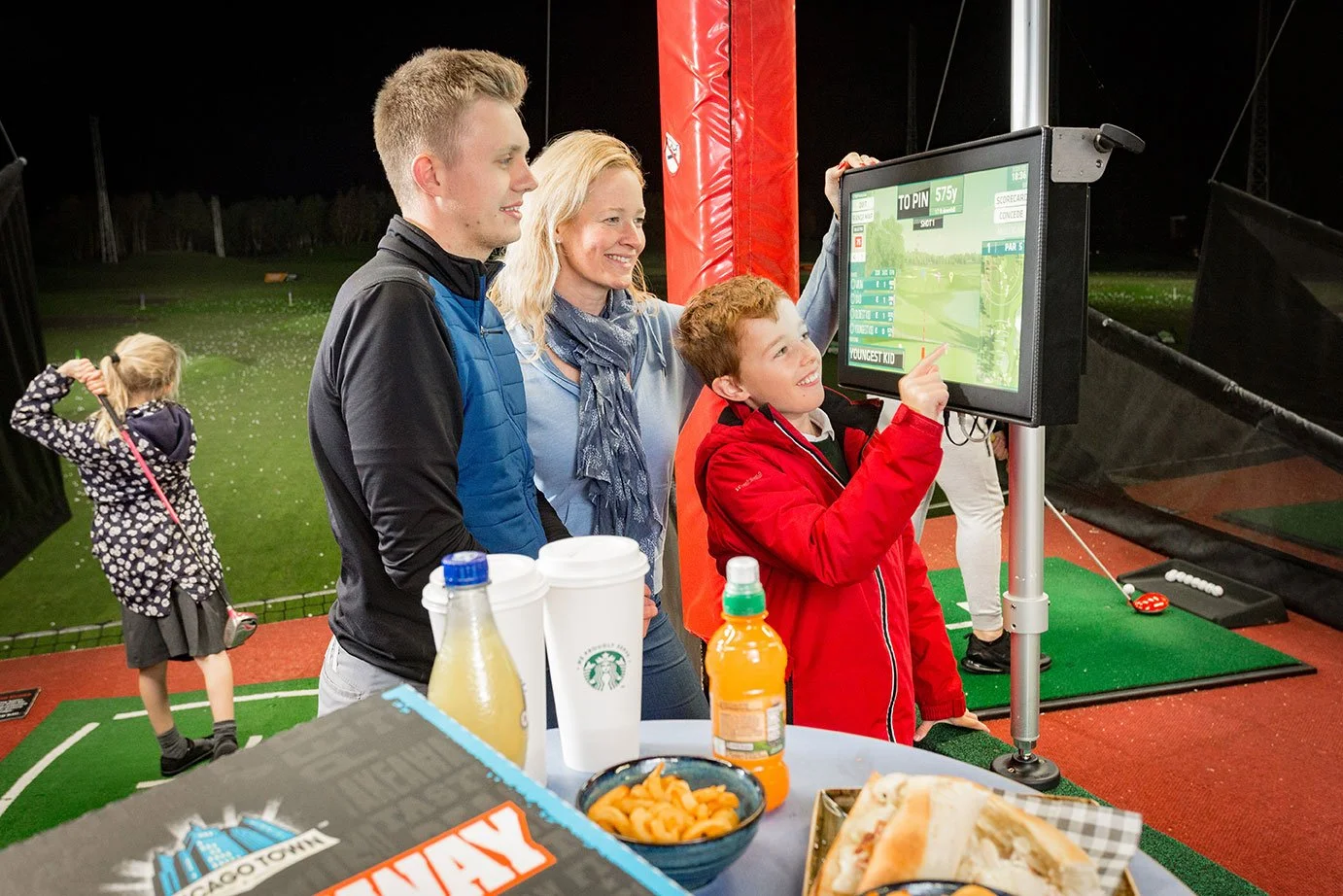 Family selecting game on Top Tracer Screen