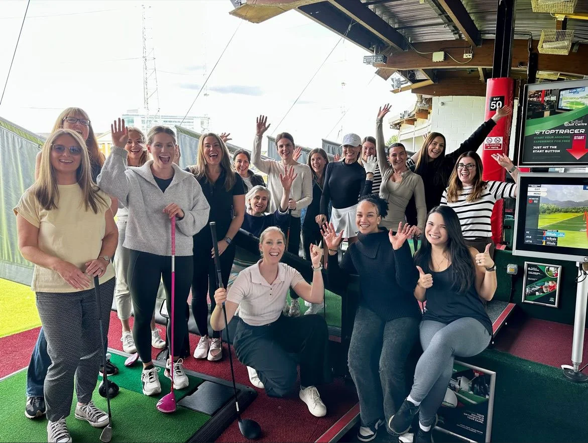 Large group of women playing golf