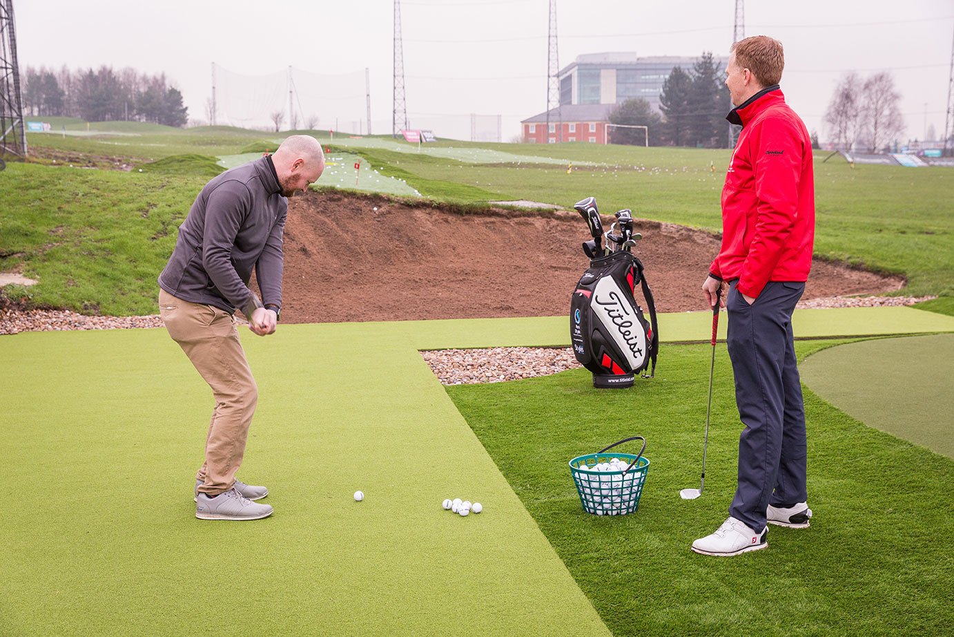 Professional Golf Coach holding a one to one lesson