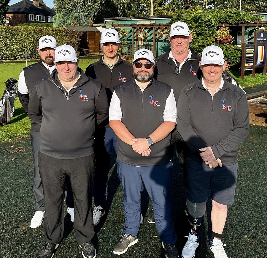 Six men in black tops and white caps