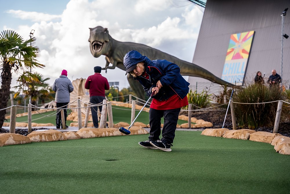 Small boy on adventure golf course