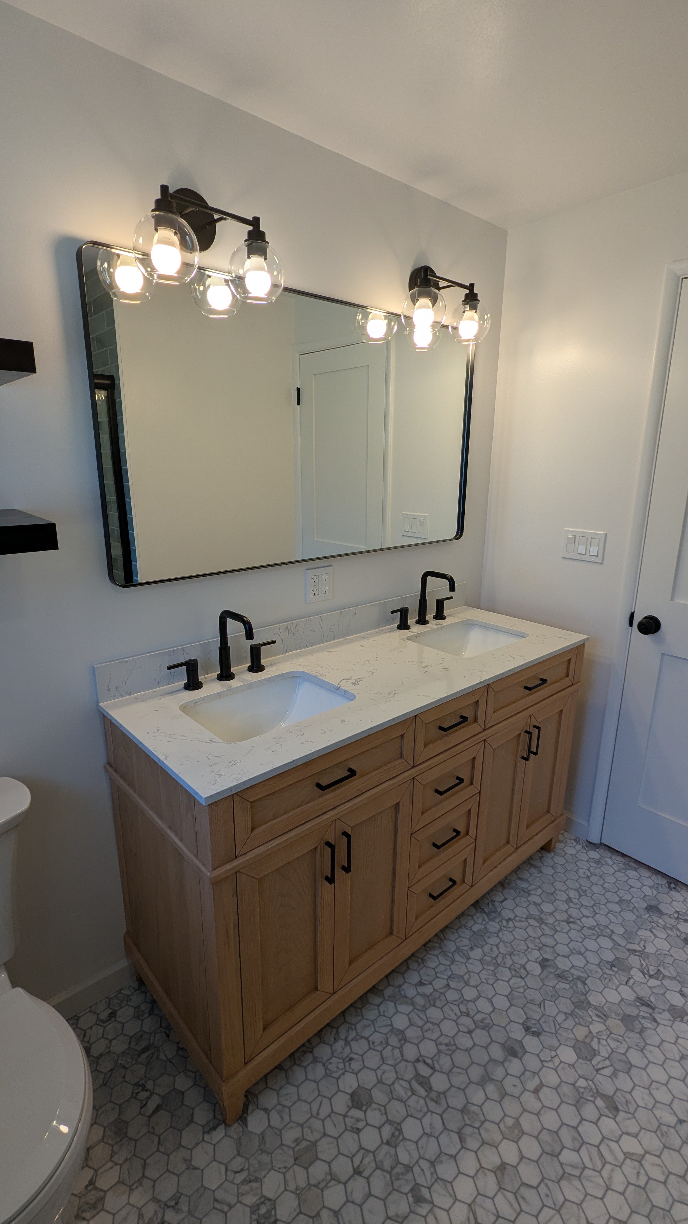 New lighting and vanity in this Bellevue area remodel. 