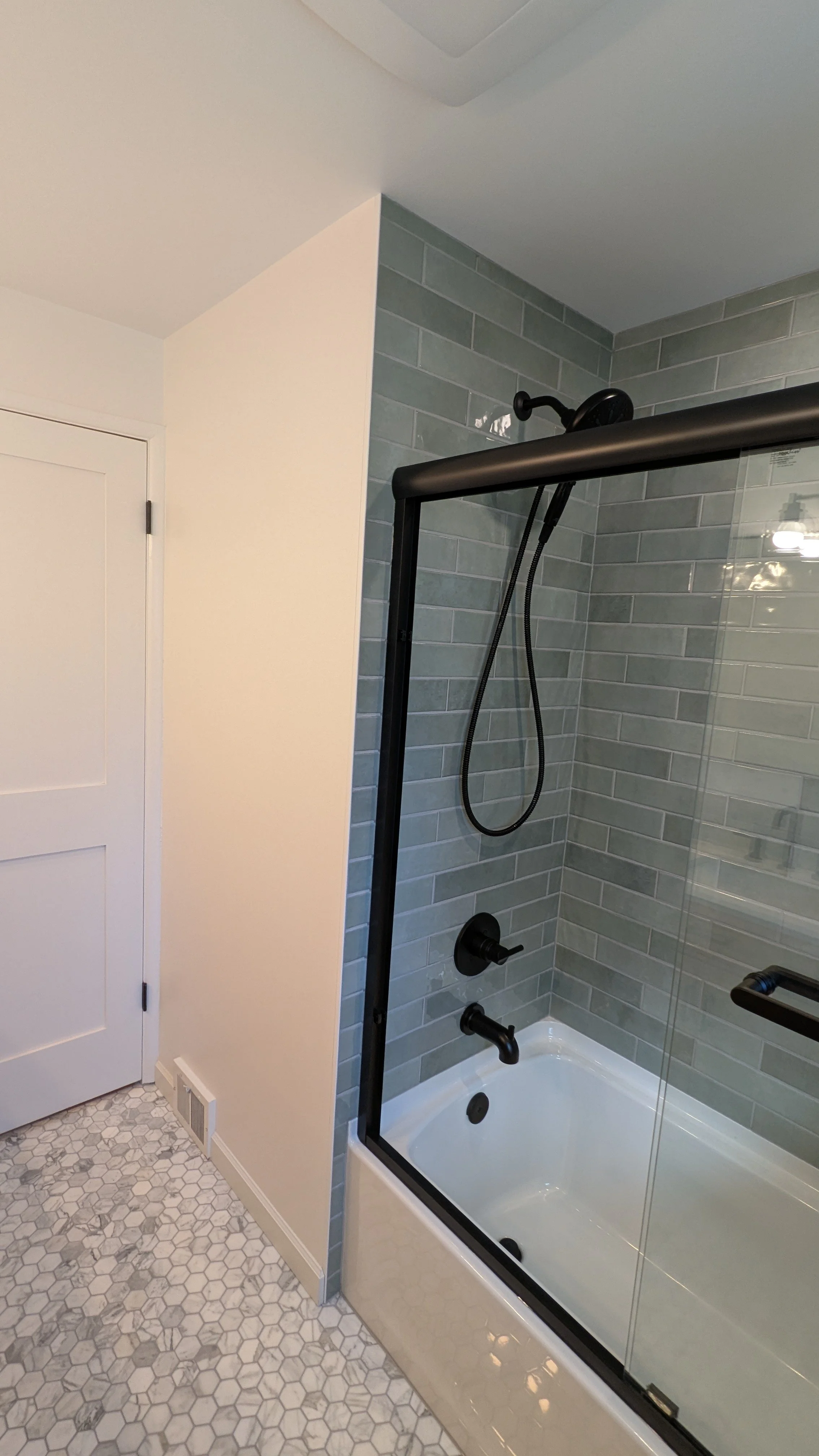 Our clients love their updated shower in this Bellevue area bathroom remodel. 