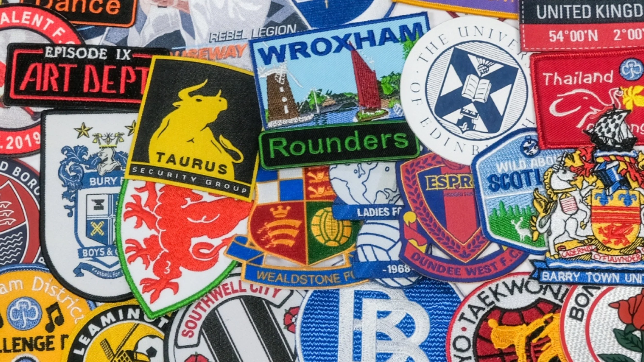 A collage of colorful embroidered patches from various sports teams, clubs, and organizations
