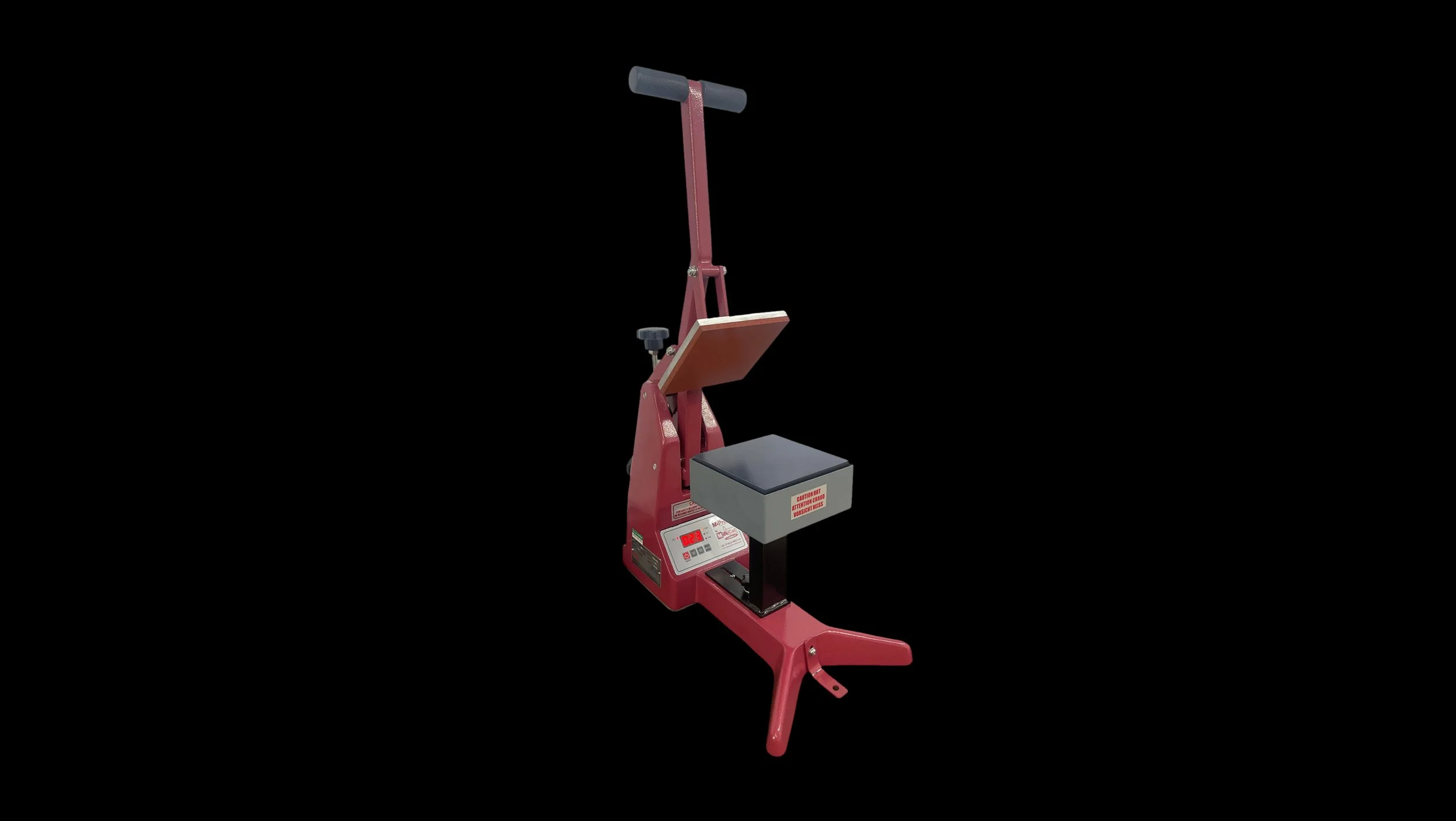 Red heat press machine with black handle and foot pedal, used for transferring designs onto fabric.