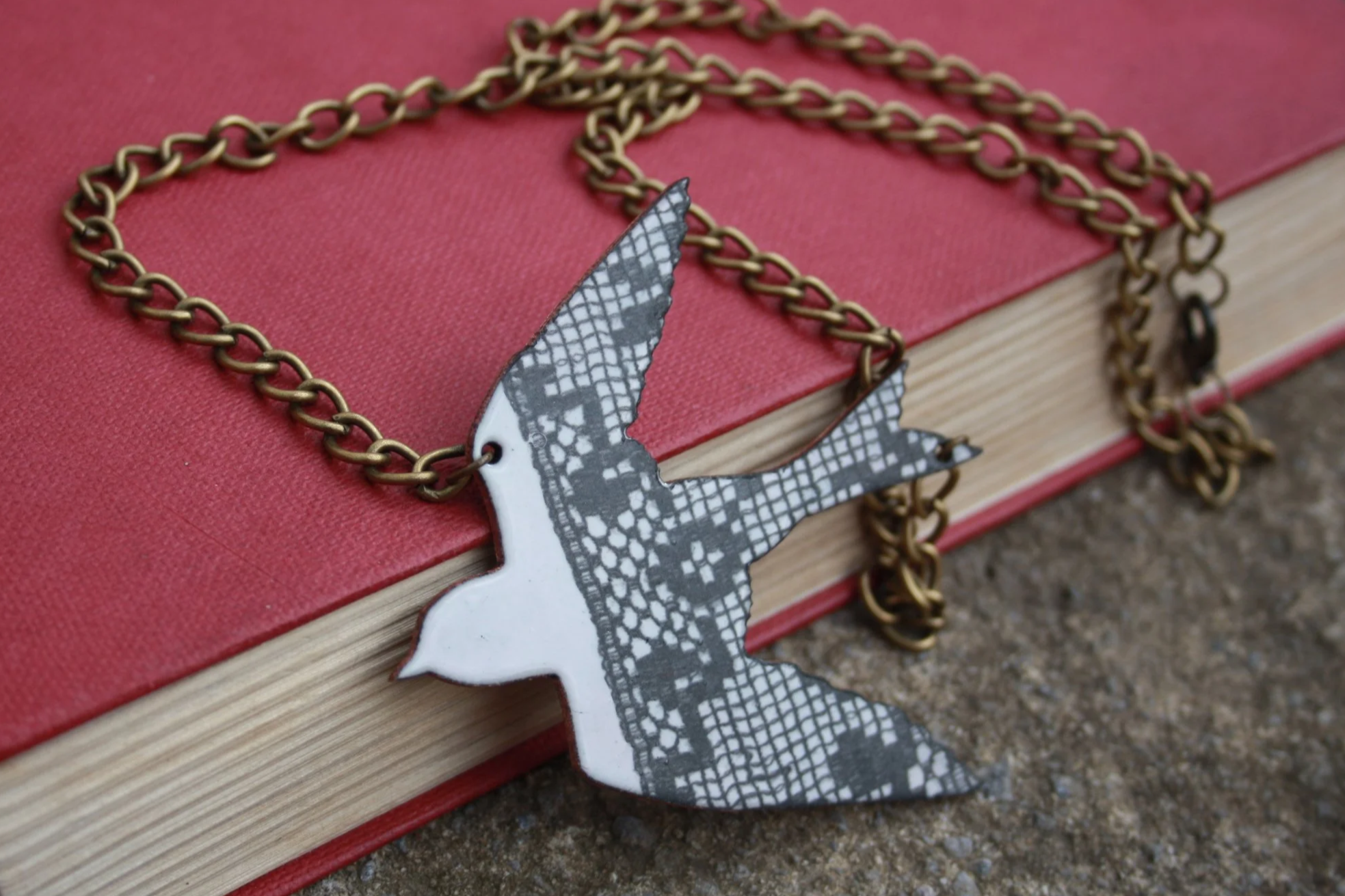 Lost and Found. Pendant necklace. Kiln fired vitreous enamel, copper and fired ceramic decal.