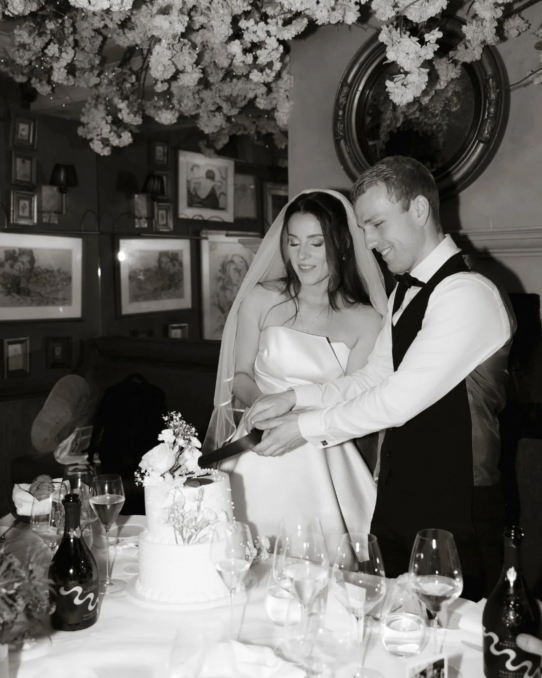 Moments from Dominique and Will&rsquo;s intimate wedding reception at @clos_maggiore , which included a cake cutting and pregnancy reveal. 🤍

@dominiquehowarth 

Venue: @clos_maggiore 
Florist: @katie.olivier.blooms
Dress: @amsale
Makeup: @georgiesb
