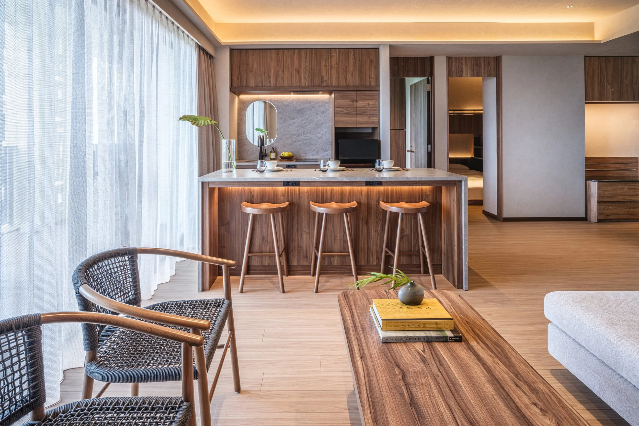 Modern hotel suite with kitchen and living area