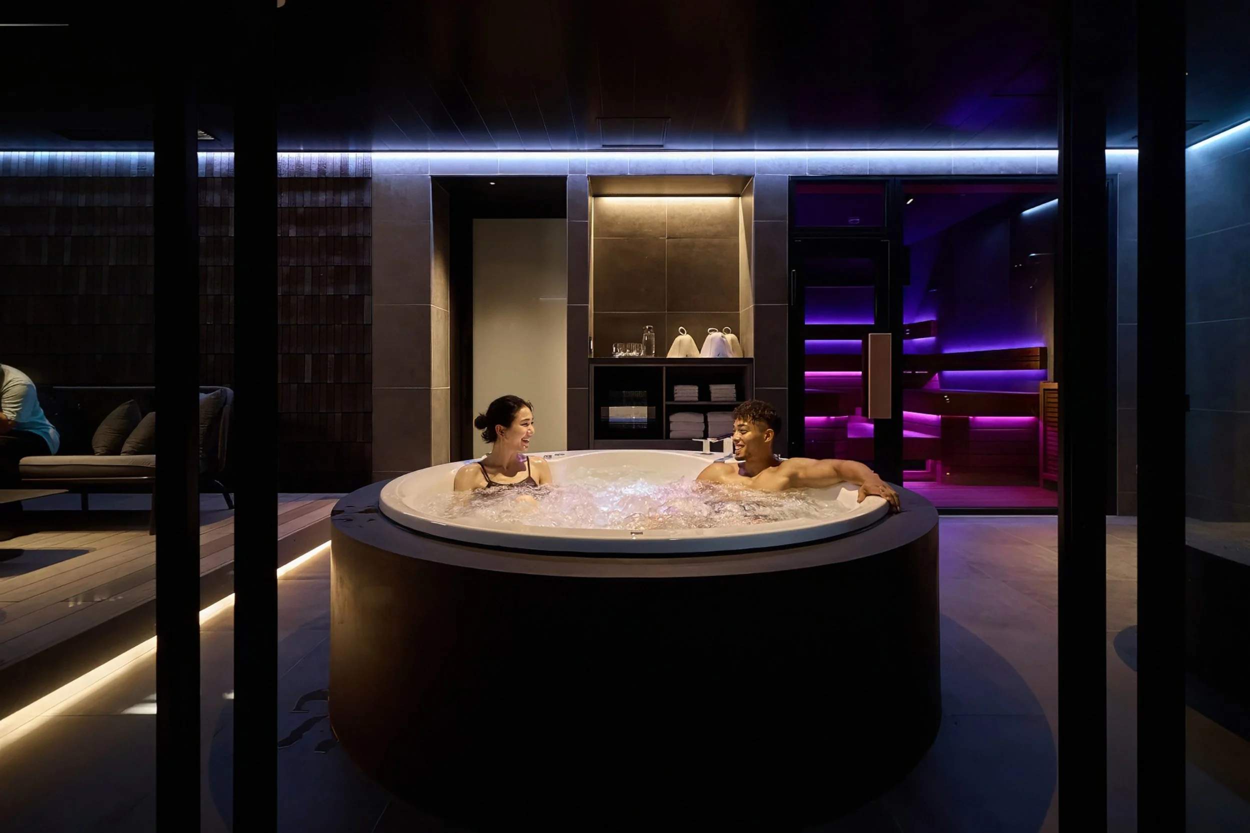 Guests relaxing in hotel spa jacuzzi