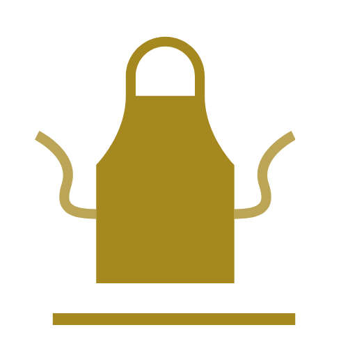 Ein goldener Kochschurz mit einem Hintergrund in Schwarz.