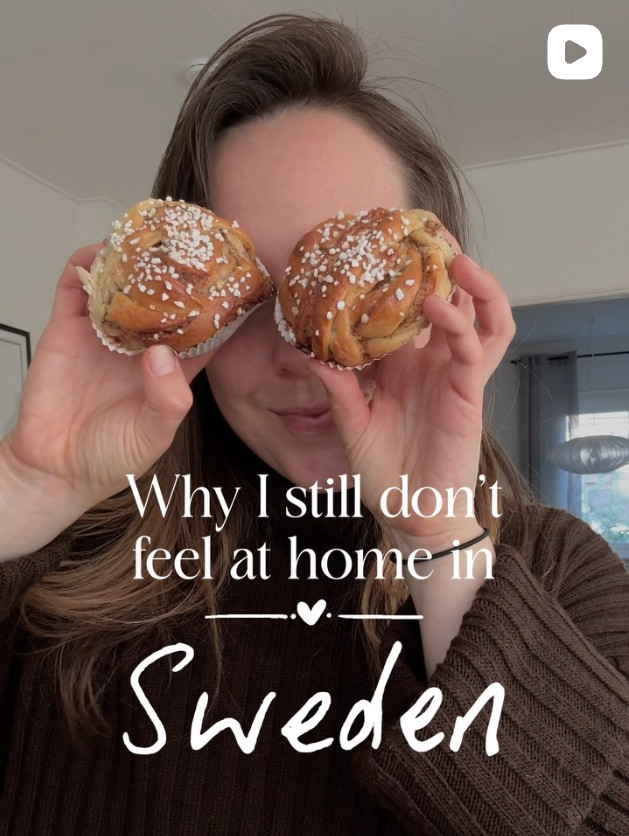Woman holding up two cinnamon buns in front of her eyes with the text "why I still don't feel at home in Sweden"
