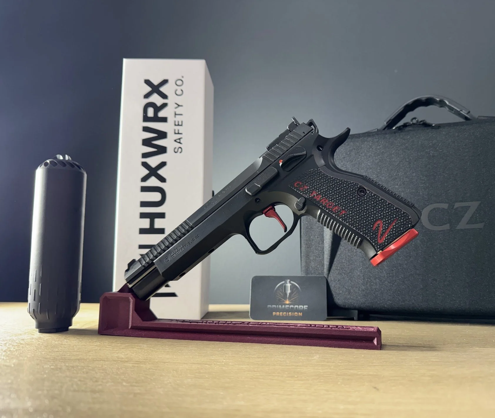 CZ target firearm alongside HUXWRX suppressors at PrimeCore Precision