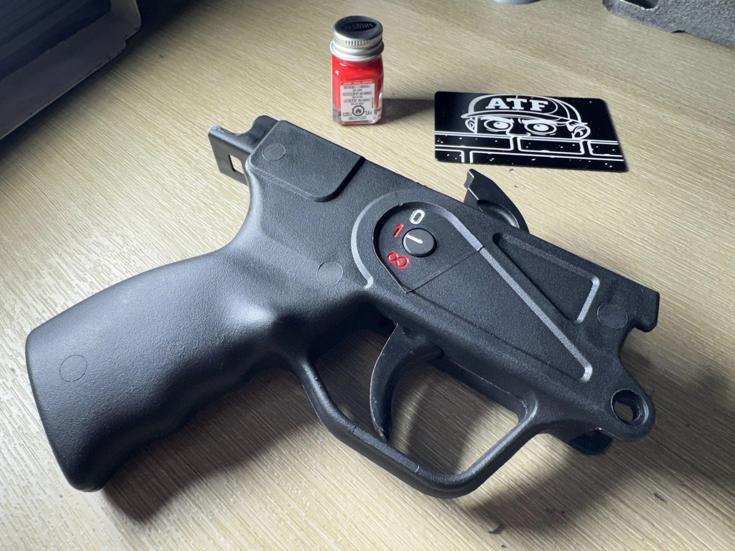 Custom engraved AP5 trigger housings with precision fiber laser marking, pictograms, clone-correct markings, NFA engraving, serial engraving, and custom selector layouts. PrimeCore Precision in Warren, Michigan provides clean, permanent engraving for