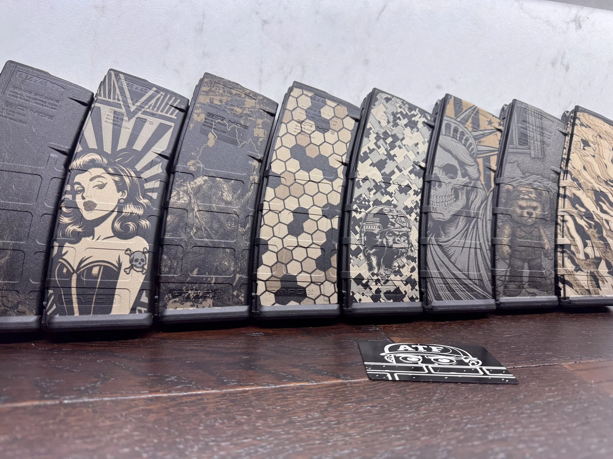 Custom engraved and laser marked Magpul PMAGs with names, logos, caliber markings, unit identifiers, loadout labels, and personalized designs. PrimeCore Precision in Warren, Michigan provides clean, permanent laser engraving on polymer magazines usin