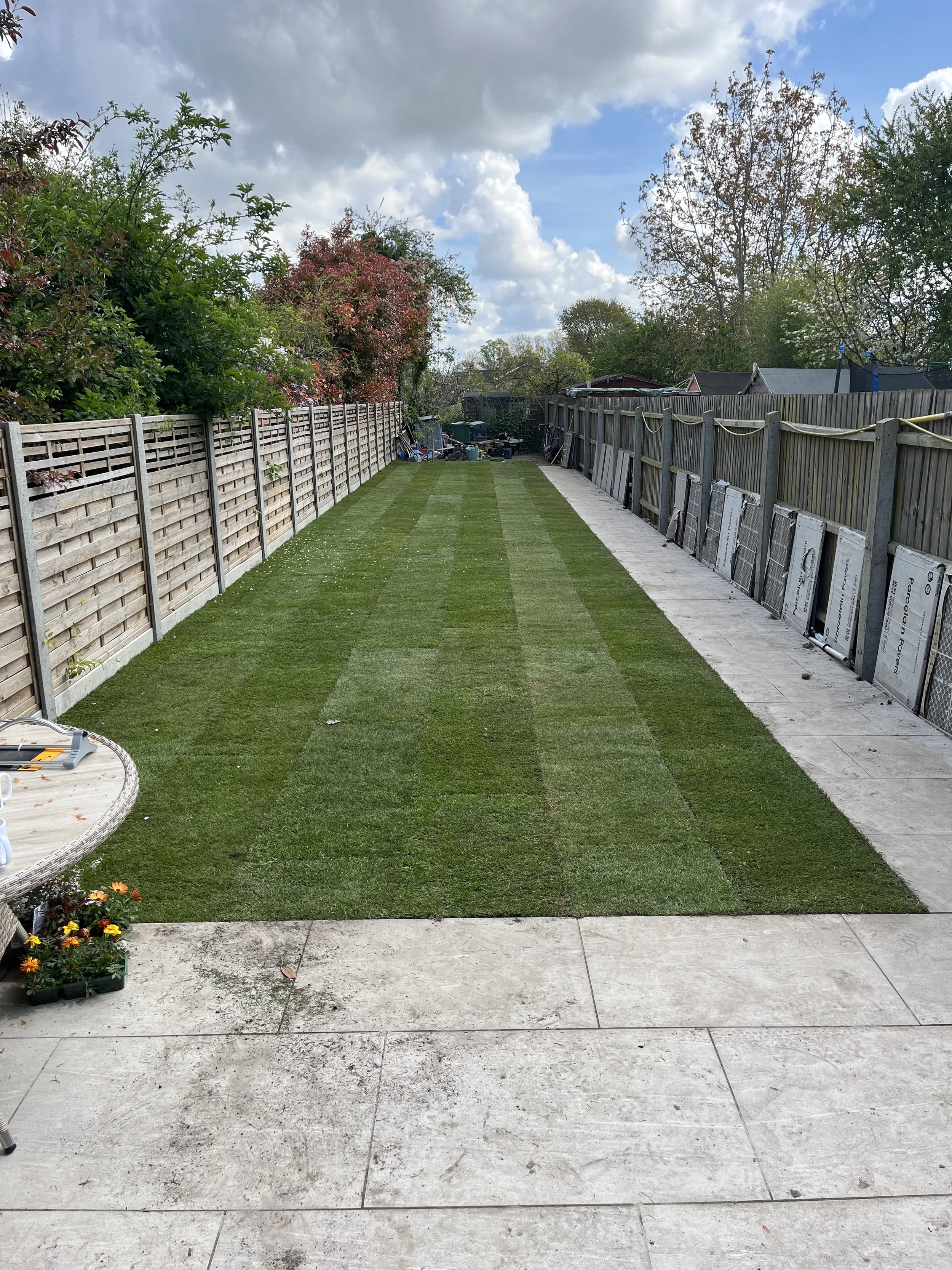 soft landscaping works with new turf and porcelain pathway in cambridge