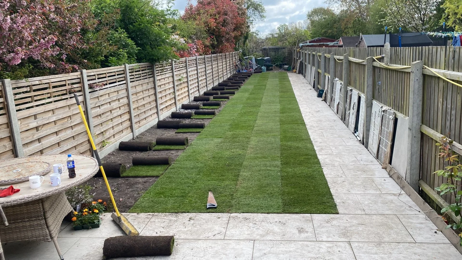 soft landscaping works with new turf and porcelain pathway in cambridge